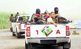 Shiite volunteers patrol after clashes with militants of the Islamic State on the outskirts of Samarra in Salahuddin province.