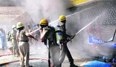 Firefighters battle a fire at the regional office of Syndicate Bank in Sector 17. A file photo