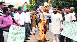 Youth Congress workers protest against the BJP government outside the Congress Bhawan in Sector 35, Chandigarh, on Wednesday. Tribune photo: Parvesh Chauhan
