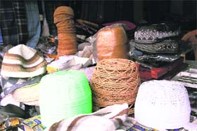 Various types of skull caps on sale at a shop on Gandhi Road in Dehradun on Wednesday