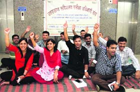 Review officers stage a dharna inside the Secretariat building in Dehradun on Wednesday