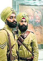 Sikhs from London recreate the life of Sikh soldiers from the 15th Ludhiana Sikhs (now 2 Sikh) stand beside a 1915 portrait of two cavalry officers by Philip de Laszlo.