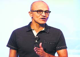 Microsoft CEO Satya Nadella speaks at an event in San Francisco, California, in this file photo. Microsoft said on Thursday it would cut around 14% of its workforce, as it halves the size of its recent Nokia acquisition and trims down other operations