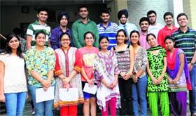 Students of Guru Gobind Singh Senior Secondary School in a jubilant mood after receiving scholarships in Chandigarh on Thursday