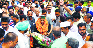 Chief Minister Virbhadra Singh being welcomed in Nalagarh on Thursday.