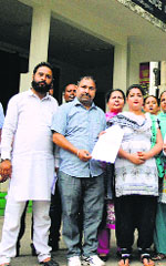 Narinder Makkar shows a copy of the memorandum