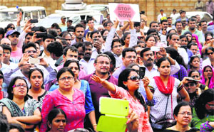 Parents protest against the rape incident outside a school in Bengaluru on Thursday
