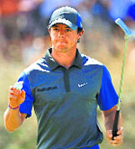 Rory McIlroy acknowledges the crowd after making a birdie putt on the 12th green during the first round of the British Open in Hoylake on Thursday.