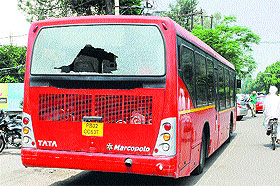 The city bus that was damaged by passengers after an altercation over the ticket price.