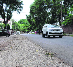 The V-5 road in Sector 18 that was widened last year is yet to be carpeted by the Municipal Corporation. 