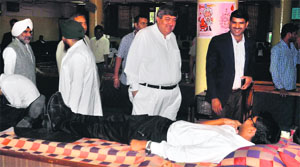 Justice Sanjay Kishan Kaul, Chief Justice of the Punjab and Haryana High Court (centre), interacts with a donor during a blood donation camp organised by the Punjab and Haryana High Court Blood Contributors Club on the court premises on Friday