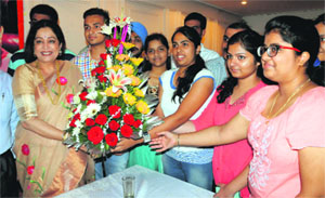 Students present a bouquet to MP Kirron Kher during a function at Panjab University on Friday. 