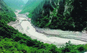 Debris and other material being disposed into the Alaknanda from the dam barrage of Visnhu Prayag Hydroelecctric project, near Joshimath.