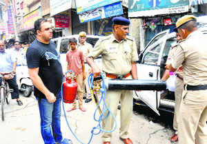 The police seize a gas cutter used in the crime from Rohtak on Thursday.