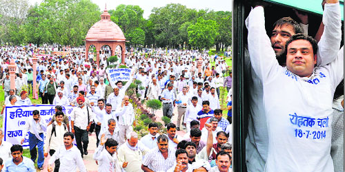 Employees of the Haryana Karamchari Sangh protest in Rohtak on Friday.