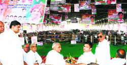 HPCC president Ashok Tanwar (second from right) and Chief Minister Bhupinder Singh Hooda (third from right) at a public meeting in Julana on Friday.