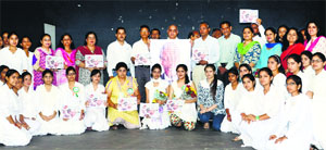 In remembrance: Students from various colleges pose for a photograph after participating in the inter-college symposium on the life and contributions of Dr Nelson Mandela at Government College for Women, Parade, in Jammu on Friday.