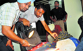 A forensic team at the crime scene.