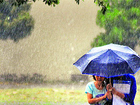 Residents enjoy rain in Ludhiana.