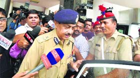 UP DGP AL Banerjee comes out of the annexe after meeting Chief Minister Akhilesh Yadav about the gruesome rape and murder of a woman in Mohanlalganj area in Lucknow on Friday.