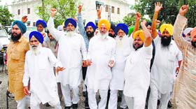 Senior Akali leader and a former Punjab Cabinet Minister Hira Singh Gabria (fourth from right) along with other SAD activists raise slogans outside Gurdwara Manji Sahib in Ambala on Friday.