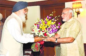 Punjab Chief Minister Parkash Singh Badal calls on Prime Minister Narendra Modi in New Delhi on Friday.