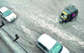 Vehicles stuck on a waterlogged road in Patiala on Friday.