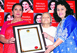 Bollywood actress Shabana Azmi, along with Rama Bhanot, mother of Neerja, confers the Neerja Bhanot Award 2013 on Rashmi Anand at St Stephens School, Sector 45, Chandigarh, on Saturday