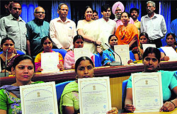 Women of Khuda Lahora Colony show their certificates for getting training under the Swarna Jayanti Shahari Rozgar Yojana of the Municipal Corporation at Panjab University on Saturday