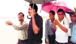 District Magistrate D Senthyl Pendiyan inspects the construction work at an embankment near flood-prone areas of the district alongwith officials from the Irrigation and Disaster Management Department in Haridwar on Saturday. A Tribune photograph