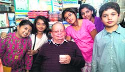 The winners of the all-India story-reading competition pose with Ruskin Bond at Cambridge Book Depot in Mussoorie on Saturday. A Tribune photograph