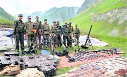 Indian troops with captured Pakistani ammunition. Tribune Photo: Manoj Mahajan
