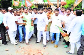 For amenities: Bharatiya Janata Yuva Morcha activists protest erratic power and water supply outside MLA Sumita Singhs residence in Karnal on Saturday
