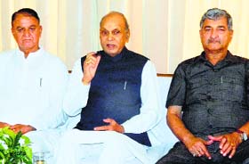 Former CM PK Dhumal addresses a press conference in Mandi on Saturday