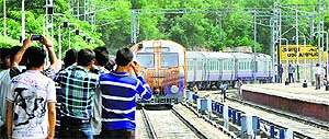 People click pictures of the train entering the Udhampur railway station. 