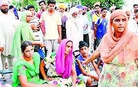 Occupants of the tempo in a state of shock at Mandi Ahmedgarh.