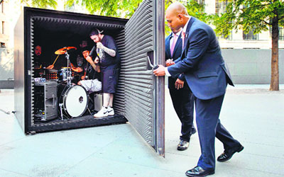 Members of the death metal group “Unfathomable Ruination” perform as they are sealed inside a 183cm by 183cm x 183cm metal cube in central London