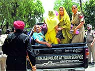 Members of the Unaided Staff of Aided Schools Front being taken away by the police personnel during their protest in Talwandi Sabo on Sunday.