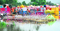 Beautifully-decorated handmade Kanwars put up for sale at Kanwar Bazaar in Haridwar. The market was waterlogged due to continuous rain