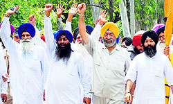 HSGPC leader Jagdish Singh Jhinda (extreme left) and his supporters take out a march in Ambala on Sunday