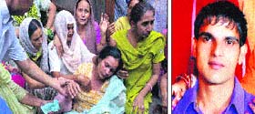 Wailing family members of the deceased Naresh Kumar Laddi (inset) at his residence at Bhargav Camp in Jalandhar on Sunday