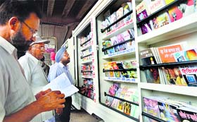 Visitors take a look at books being distributed by the Tarksheel Society in Ludhiana on Sunday