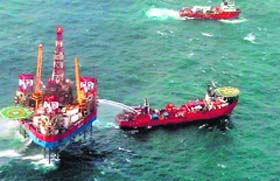 ONGC team works to plug the gas leak in a rig at Bombay High