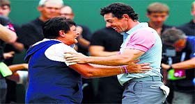Rory McIlroy of Northern Ireland celebrates with his mother Rosie on the 18th green after winning the British Open at the Royal Liverpool Golf Club in Hoylake on Sunday.