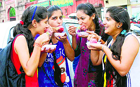 Girls relish burf ka gola outside Khalsa College in Amritsar.