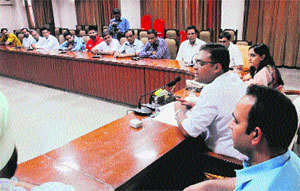 DC Basant Garg at a meeting with liqour contractors in Bathinda on Monday.