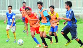 City footballers in action during the trials for the U-14 and U-16 teams being conducted by Bajaj Allianz at Panjab University in Chandigarh on Monday.