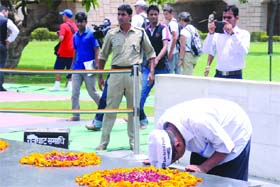 Former Delhi Chief Minister Arvind Kejriwal pays tribute at Rajghat in New Delhi on Monday