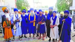 Nihangs at Chhati Patshahi gurdwara in Kurukshetra on Monday. tribune photo