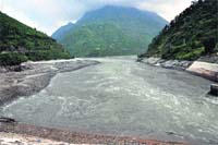 The water level of the Pandoh Dam goes down after flushing on Monday. Photo: Jai Kumar
